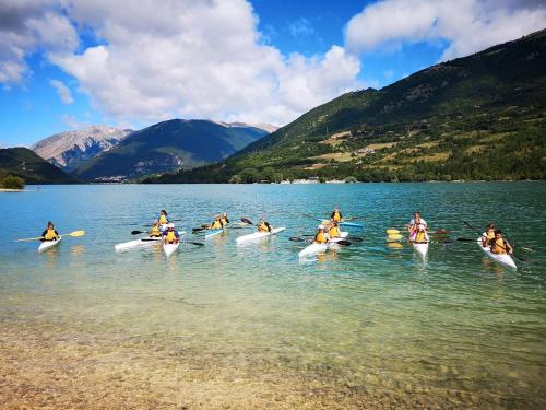 a group of people in kayaks on a lake at Villa Ola in Barrea
