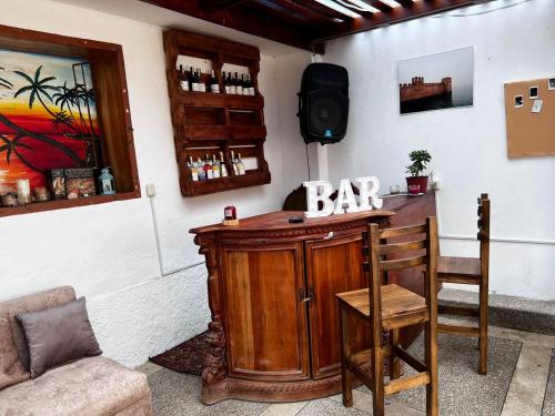 a bar in the corner of a room at Hostel las Palmas in Vilcabamba