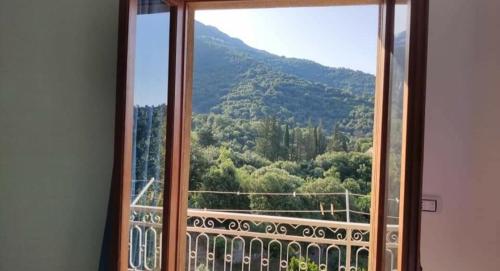 a window with a view of a mountain at Sa Dommu 'e su coro in Triei