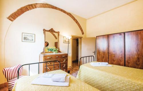 Posteľ alebo postele v izbe v ubytovaní Agriturismo Fattoria Il Piano - Appartamento Aia - San Gimignano