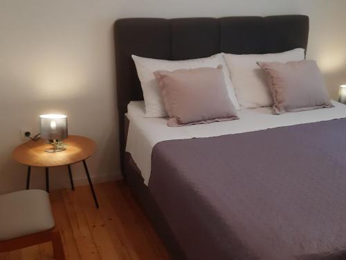 Ένα ή περισσότερα κρεβάτια σε δωμάτιο στο Apartments Lug 2, new and comfortable with pool