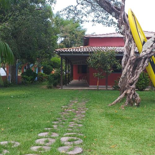 a yellow frisbee sitting on a tree in a yard at Hostel Pousada do Tapajós in Alter do Chao