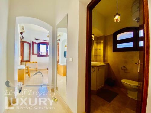 a bathroom with a toilet and a sink in a room at Private Villa Y51 - 3 BedRooms at El-Gouna in Hurghada