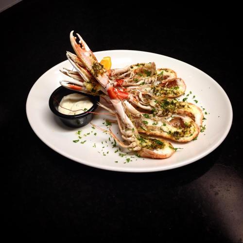 a plate of food with a lobster on a table at The Inn @ Y-Not in Thurso