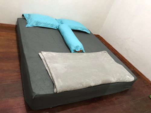 Postel nebo postele na pokoji v ubytování Muda Raya Homestay