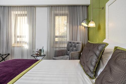 Postel nebo postele na pokoji v ubytování Harmony Hotel - an Atlas Boutique Hotel