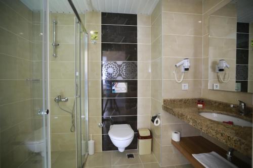 Vonios kambarys apgyvendinimo įstaigoje Almera Park Apart Hotel