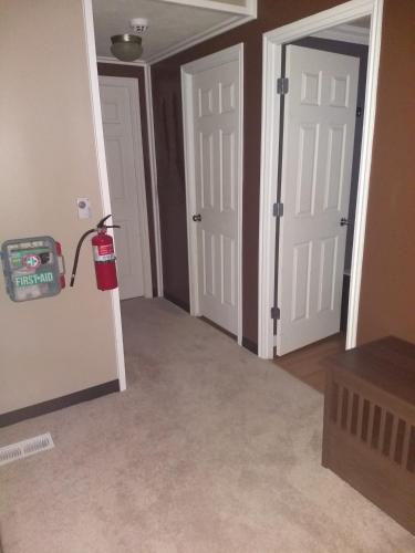 a room with two doors and a fire hydrant at Curt's cozy room rentals in Wendover
