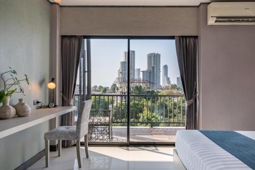Katil atau katil-katil dalam bilik di Manhattan Pattaya Hotel - SHA Extra Plus