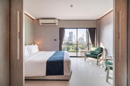Katil atau katil-katil dalam bilik di Manhattan Pattaya Hotel - SHA Extra Plus