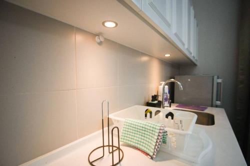 a kitchen counter with a sink and a sink at Luxury Penthouse iCity Near Mall & Themepark FREE PARKING WIFI in Shah Alam