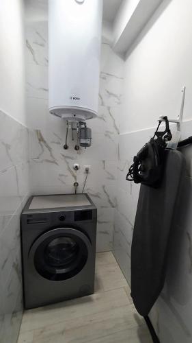 a washing machine in a bathroom with a camera at Villa Marija in Sveti Filip i Jakov