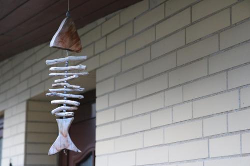 a bunch of bones hanging on a building at Gemütliches Meeresstübchen, zentrums- und hafennah in Neustadt in Holstein