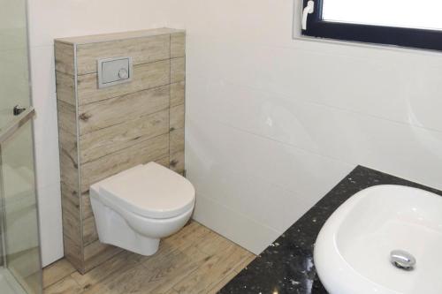 a bathroom with a toilet and a sink at holiday home, Nowe Warpno in Nowe Warpno