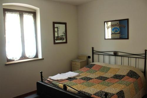 Postel nebo postele na pokoji v ubytování Da Ginetto Assisi