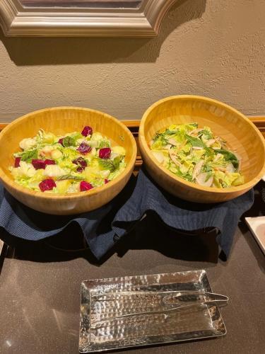 two bowls of food sitting on top of a counter at River inn Station in Kaohsiung