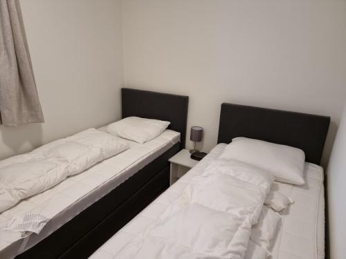 Llit o llits en una habitació de Vakantiewoning Maas en Waal 195