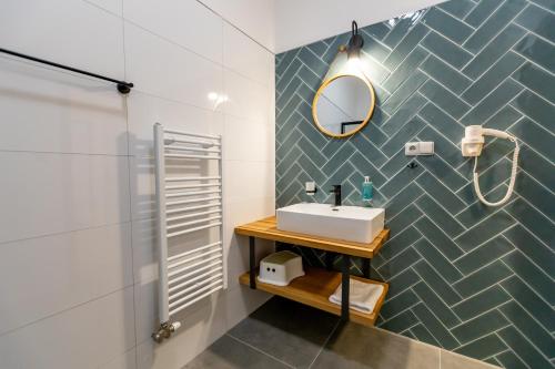 a bathroom with a sink and a mirror at Benátky 214 in Vranov nad Dyjí
