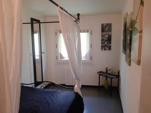 Ein Bett oder Betten in einem Zimmer der Unterkunft Appartement accueillant à Beaucaire - 90 m², idéal pour les familles