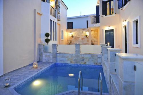 a swimming pool in a house with a bath tub at Cottage, Panormo in Panormos Rethymno