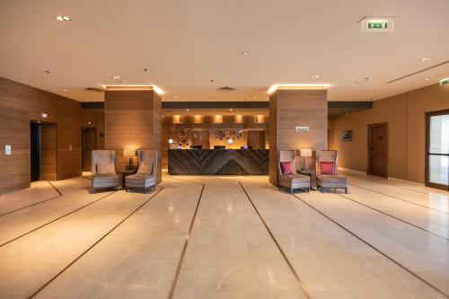 a ballroom with chairs and a dance floor at Crowne Plaza Porto, an IHG Hotel in Porto