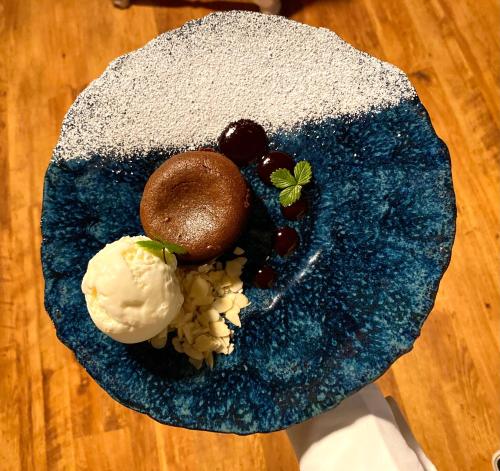 a plate of food with ice cream on a table at Vergi Sadam & Restoran Wirkes' in Vergi