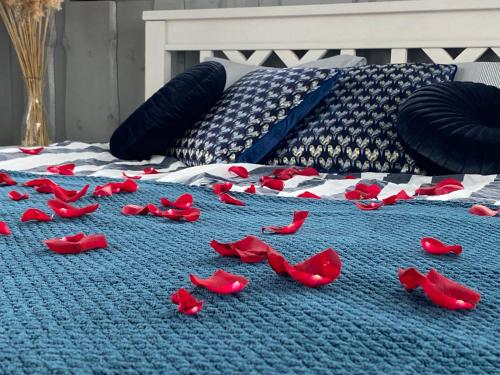 a group of red shoes on a bed at Vergi Sadam & Restoran Wirkes' in Vergi