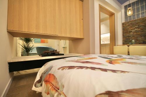 A bed or beds in a room at Beautiful Loft in Tarragona