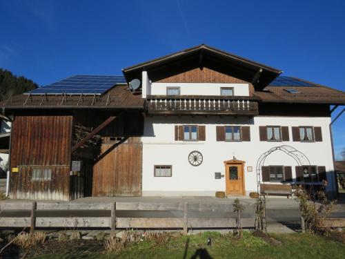 a large building with a clock on it at Gästehaus Wolf in Pfronten