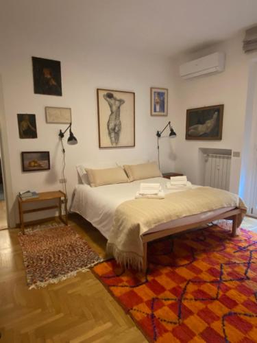 a bedroom with a bed and a rug at Salasco 20 - Bocconi Porta Romana stylish apt! Self Check- In in Milan