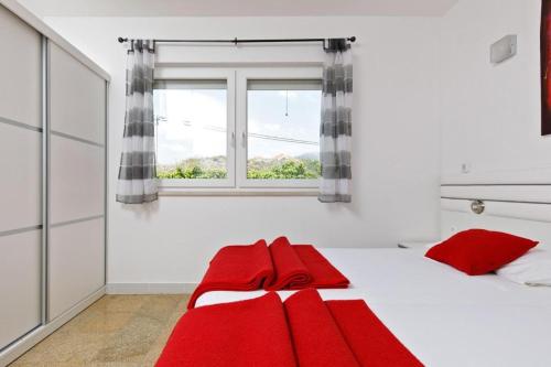 Posteľ alebo postele v izbe v ubytovaní Beach Apartments in Stobrec
