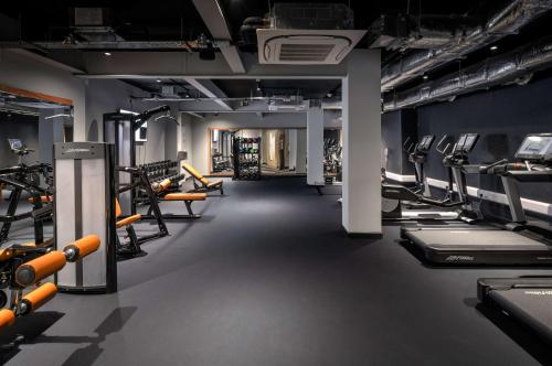 a gym with lots of treadmills and machines at YOTEL Edinburgh in Edinburgh
