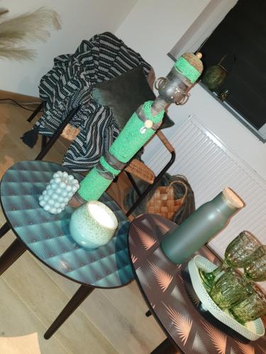 a chair with green bracelets on it in a room at La Mara Élo in Sart-lez-Spa