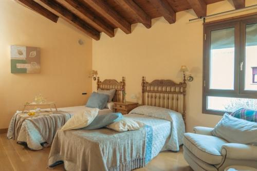 מיטה או מיטות בחדר ב-El Pajar de Trescasas