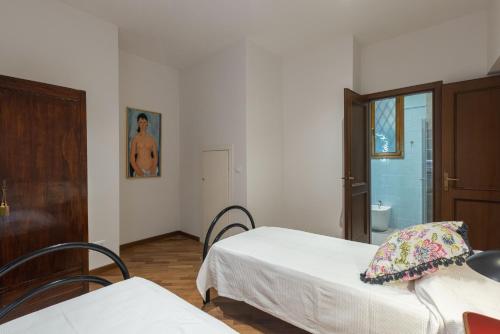 Posteľ alebo postele v izbe v ubytovaní Modi, Bologna by Short Holidays
