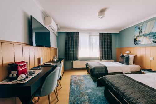 Postel nebo postele na pokoji v ubytování Hotel De Kalvaar