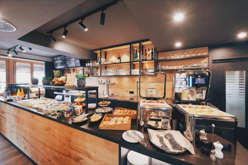 a kitchen with a counter with food on it at Hotel Hanauerhof in Appenweier