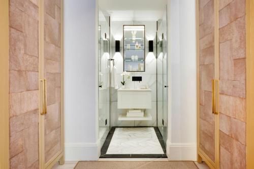 a bathroom with a sink and a mirror at âmé by NOAH in Cape Town