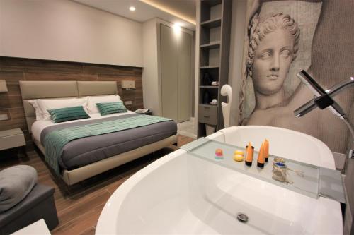 Postel nebo postele na pokoji v ubytování il sogno di afrodite luxury b and b