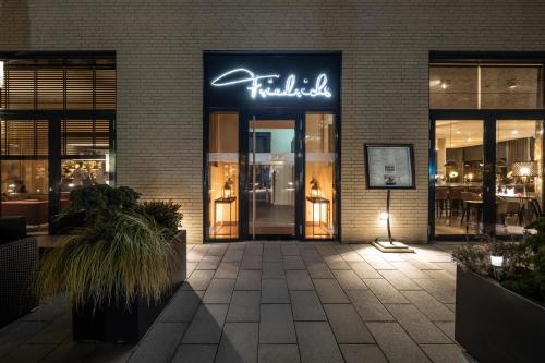 a store with a sign on the front of a building at Hotel 47° in Konstanz
