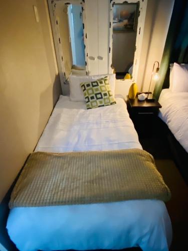 a small room with two beds in a plane at Cottonwood Guesthouse Oasis in Bloemfontein