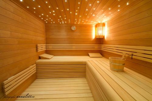 a large wooden sauna with a bucket in it at Hotel Bero in Ostend