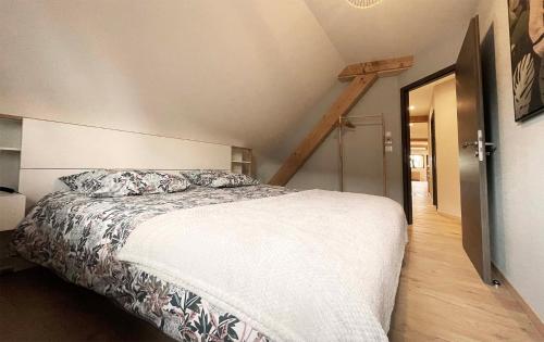 Postel nebo postele na pokoji v ubytování La Goguette - Charmant gîte chez le vigneron