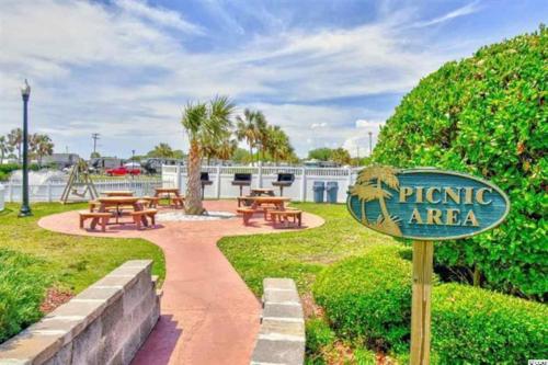 a sign for a picnic area in a park at SeaRenity by the Sea - Luxury & Romance Await in Myrtle Beach