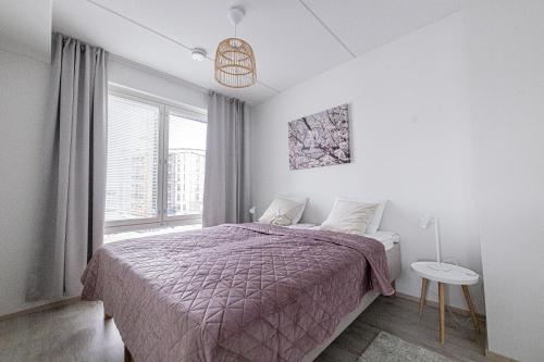 Кровать или кровати в номере Apartment, SleepWell, Nuutti