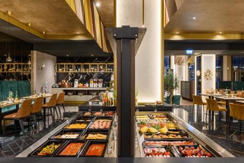 a buffet line with many different types of food at Emerald Hotel by Continental Group in Budapest