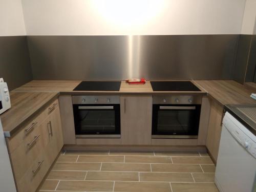 a kitchen with a stove and a counter top at Gîte Mont Joly in Saint-Gervais-les-Bains