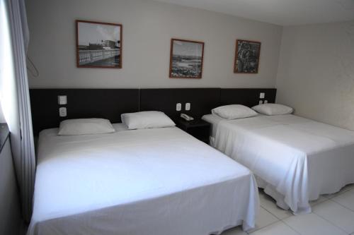 Katil atau katil-katil dalam bilik di Absolutte Hotel