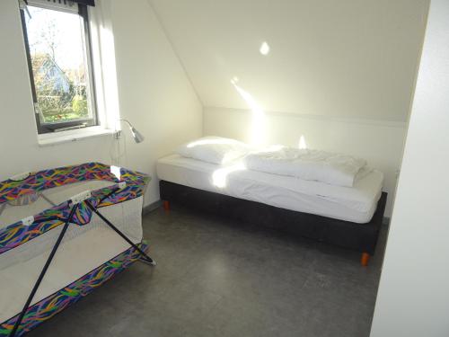 Postel nebo postele na pokoji v ubytování Kustverhuur, Park Schoneveld, Zeemeeuw 203
