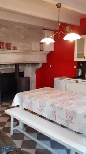 a kitchen with a table with boxes on it at Studio meublé 50m2 - Entrée indépendante in Demange-aux-Eaux